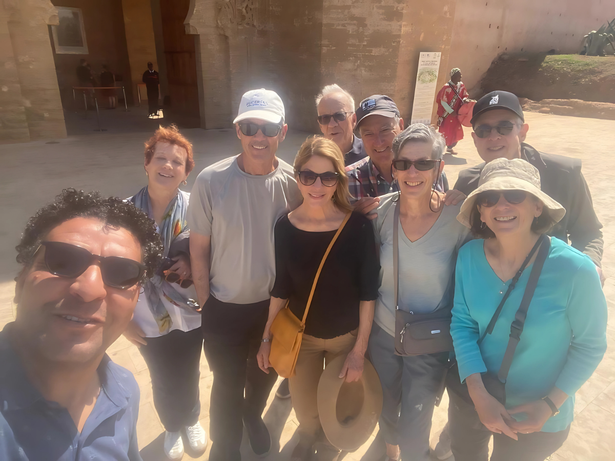 Omar with happy travelers at historic site
